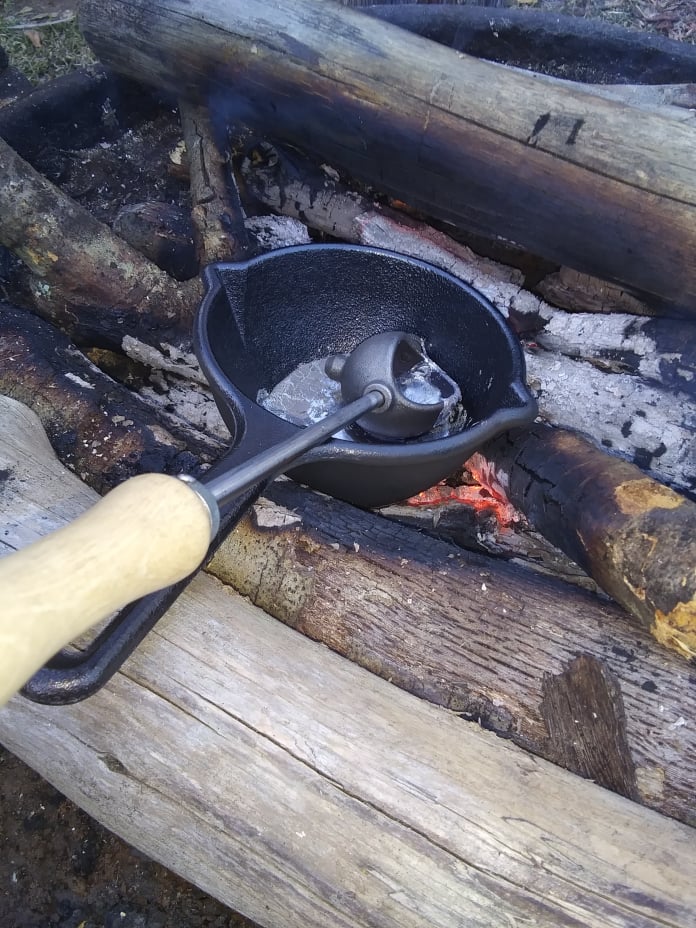 casting lead on camp fire