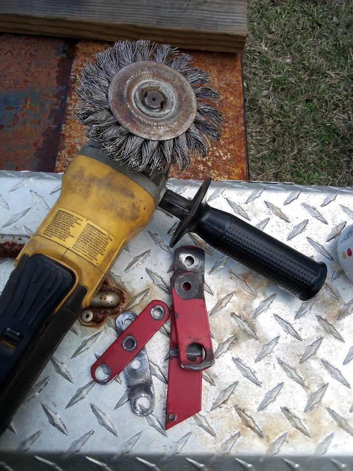 cleaning linkage parts with wire wheel