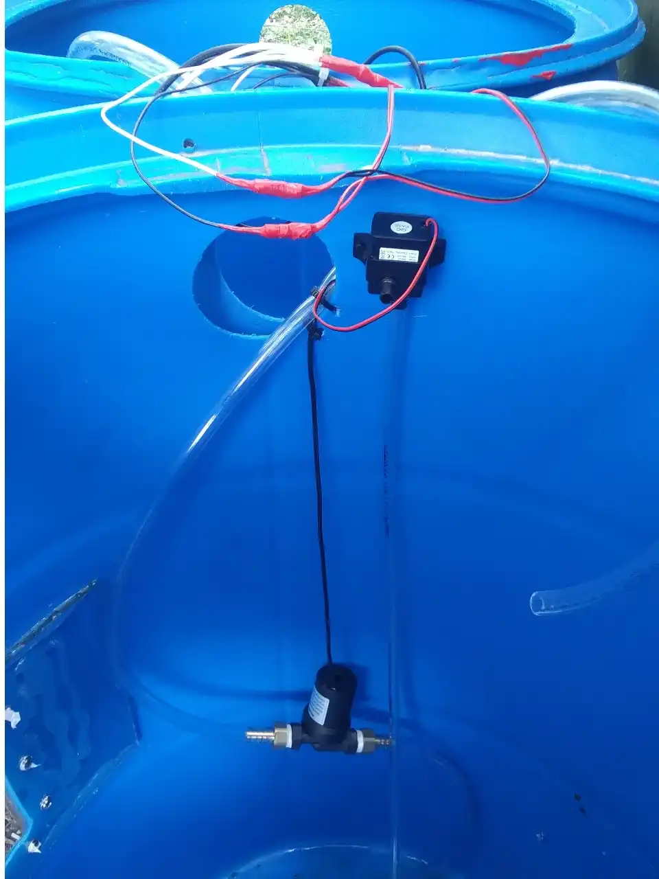 pump hanging in barrel